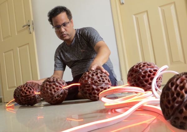  This artist depicts the ever-flowing cosmic energy through Rudraksha installation